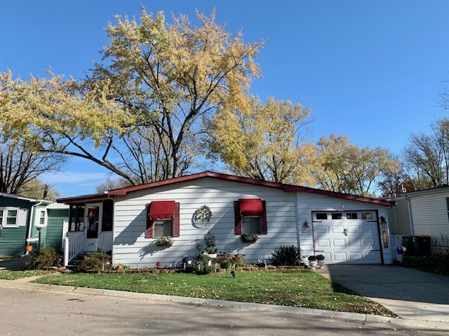 1159 Lake Terrace Road Elgin, IL 60123 - Photo 1 of 14 a front view of a house with garden
