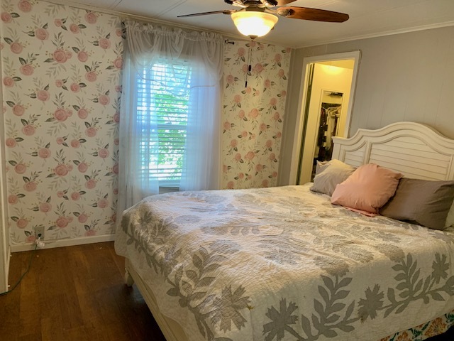 1159 Lake Terrace Road Elgin, IL 60123 - Photo 7 of 14 a large bed sitting in a bedroom next to a window and a chandelier