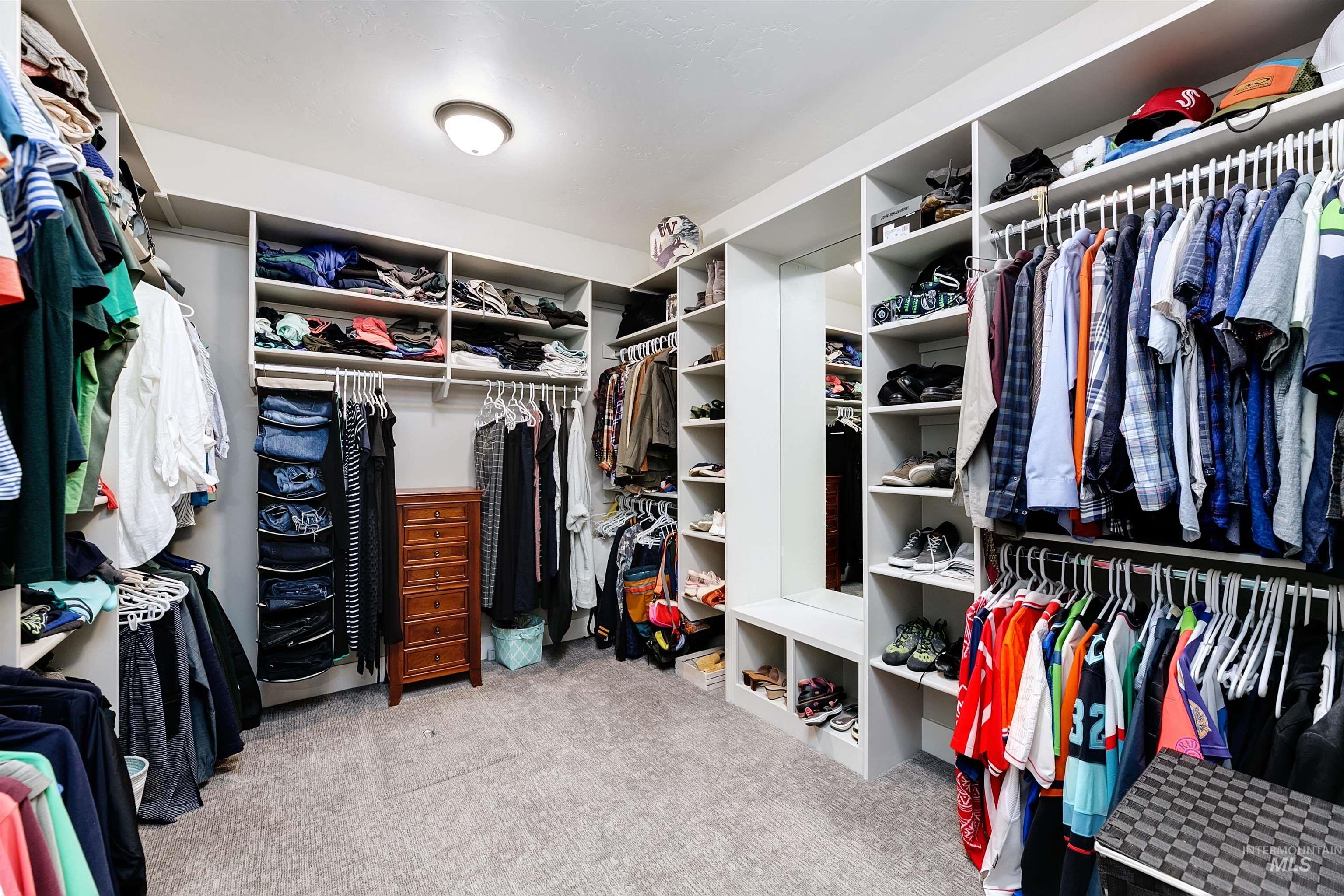 5463 North Exeter Way Meridian, ID 83646 - Photo 10 of 36 Spacious Primary walk-in closet includes generous built-ins and custom mirror.