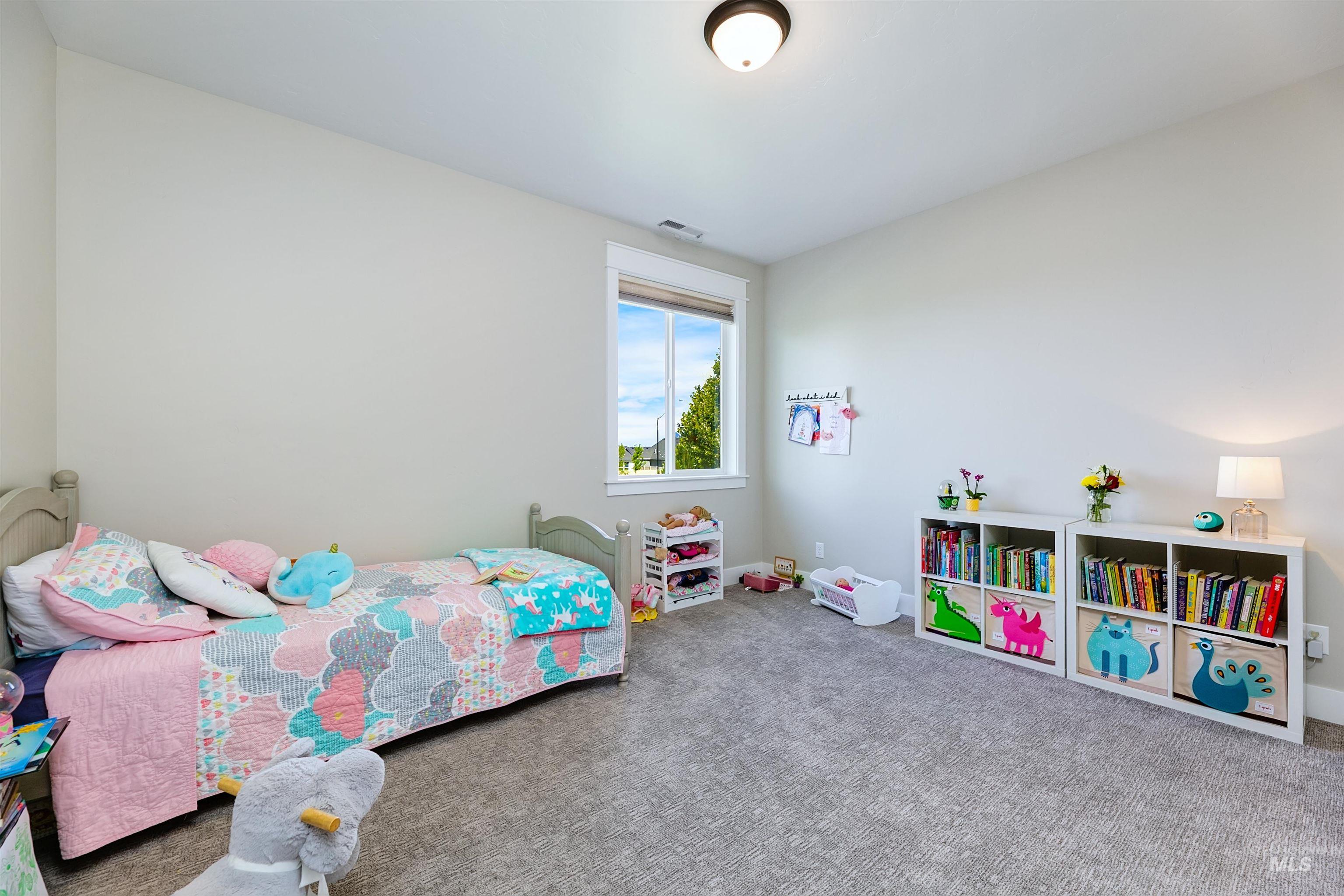 5463 North Exeter Way Meridian, ID 83646 - Photo 13 of 36 Large upstairs bedroom with walk-in closet.
