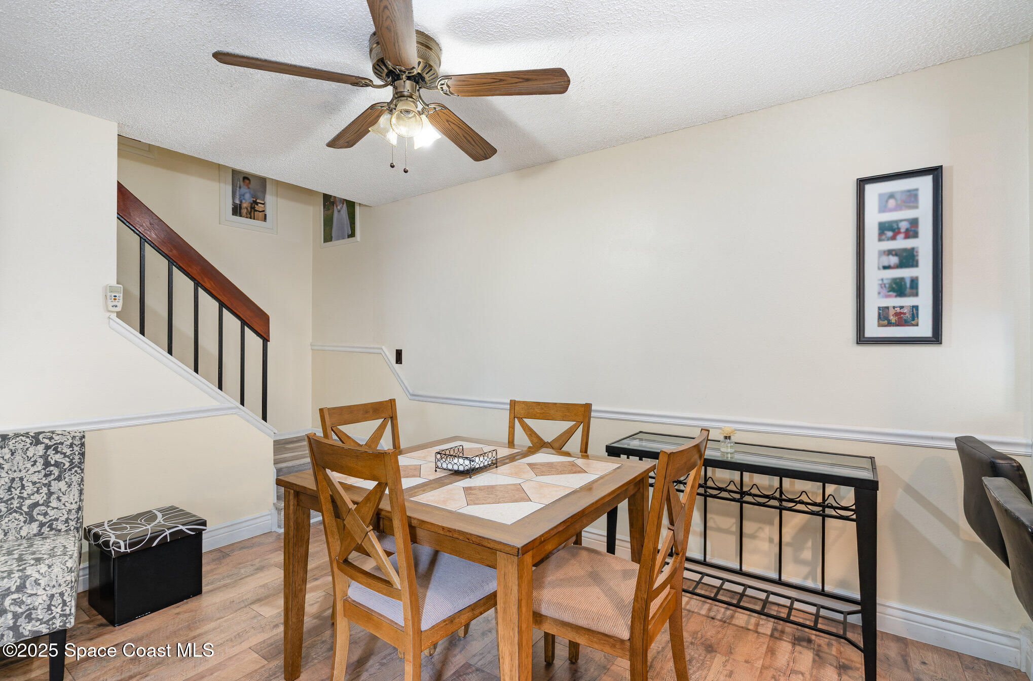 1010 Abada Court Northeast, Unit 102 Palm Bay, FL 32905 - Photo 13 of 37 a view of a dining room with furniture and a chandelier