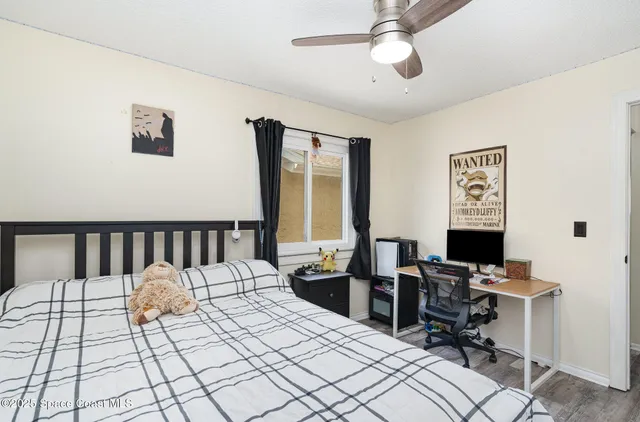 a bed room with a bed and a window