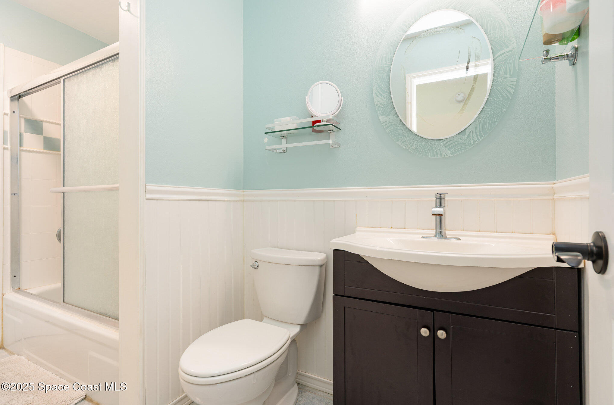 1010 Abada Court Northeast, Unit 102 Palm Bay, FL 32905 - Photo 20 of 37 a bathroom with a sink mirror and toilet