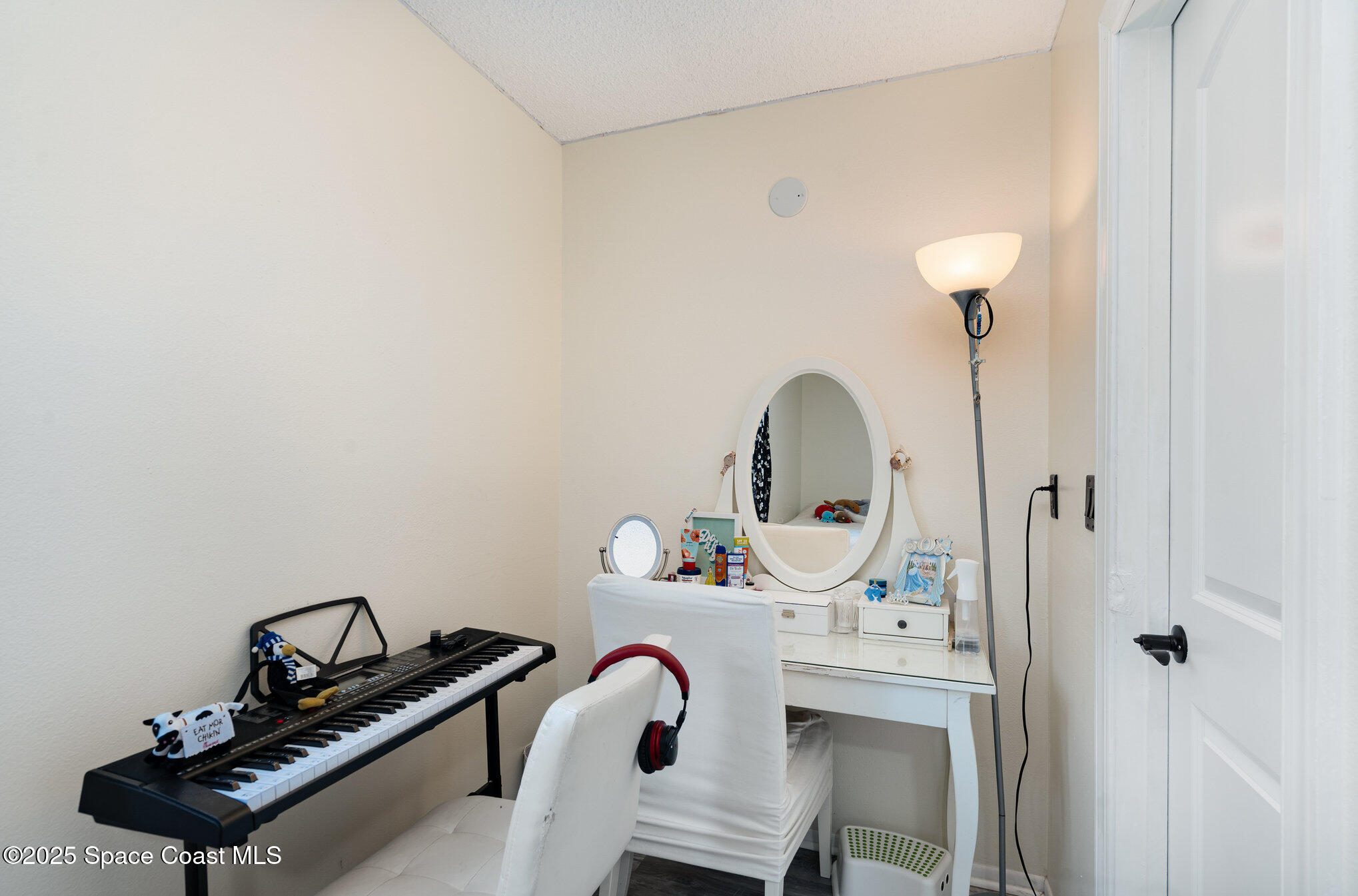 1010 Abada Court Northeast, Unit 102 Palm Bay, FL 32905 - Photo 22 of 37 a room with a sink and gym equipment