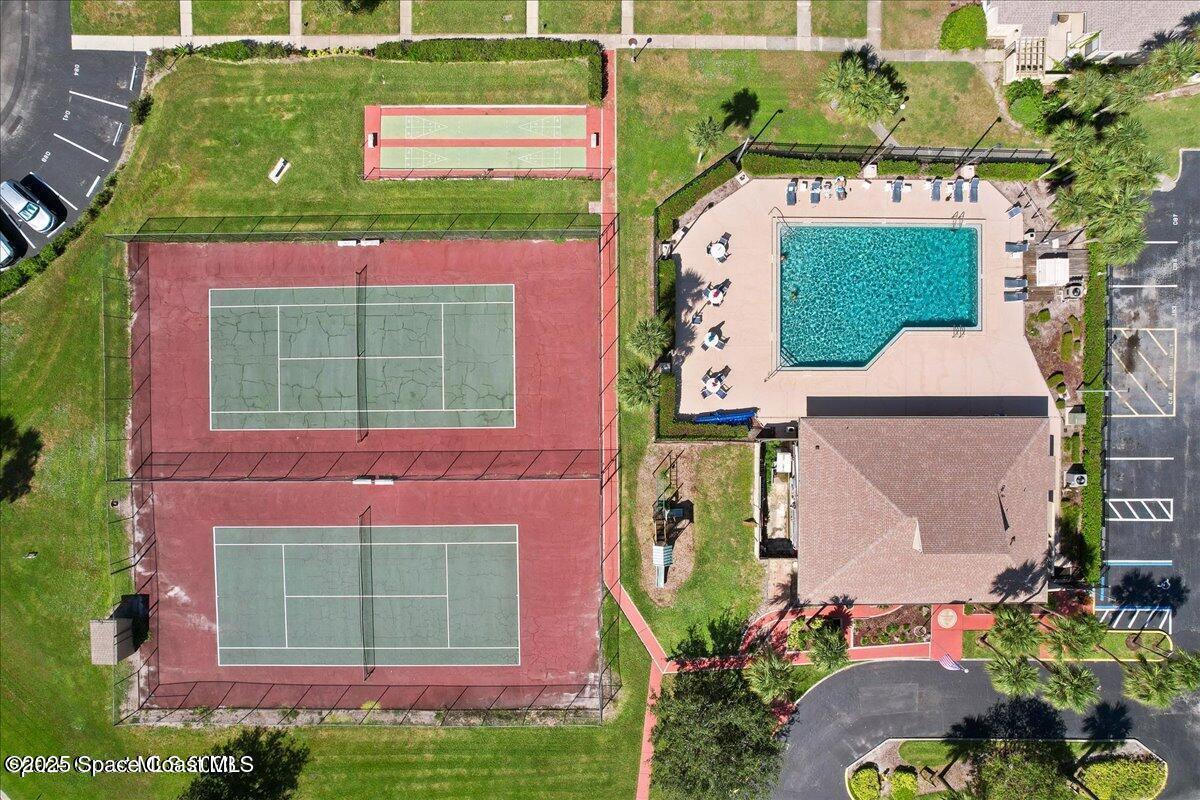 1010 Abada Court Northeast, Unit 102 Palm Bay, FL 32905 - Photo 29 of 37 front view of a house with a small yard