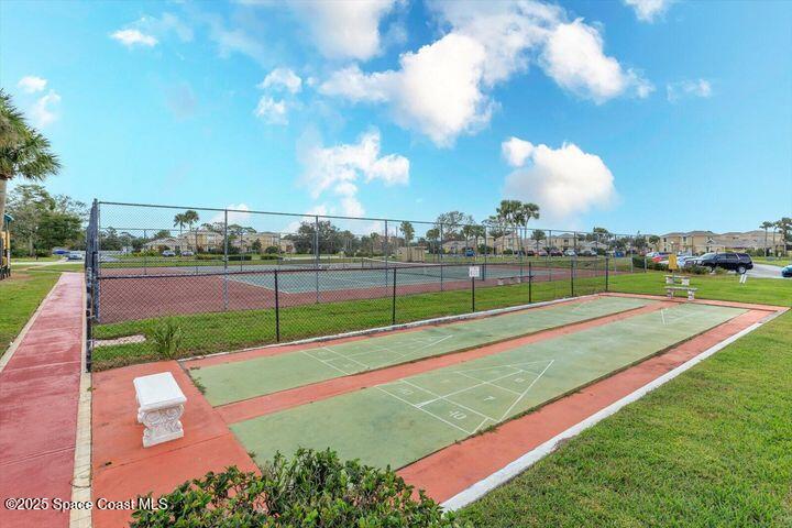 1010 Abada Court Northeast, Unit 102 Palm Bay, FL 32905 - Photo 31 of 37 a view of a golf course with a lake