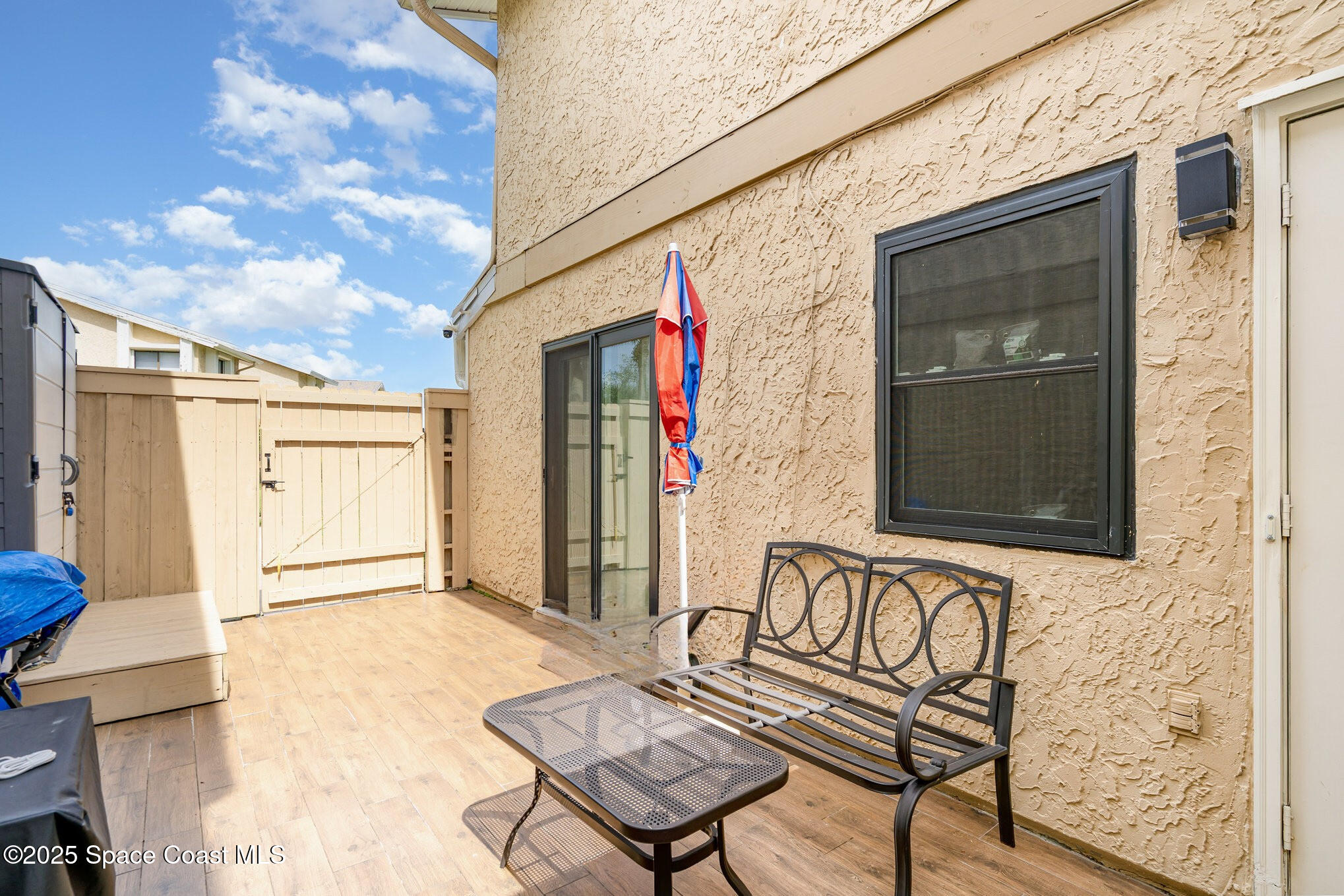 1010 Abada Court Northeast, Unit 102 Palm Bay, FL 32905 - Photo 4 of 37 a view of a bench in the house