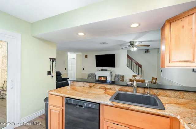 a kitchen with a sink and a mirror