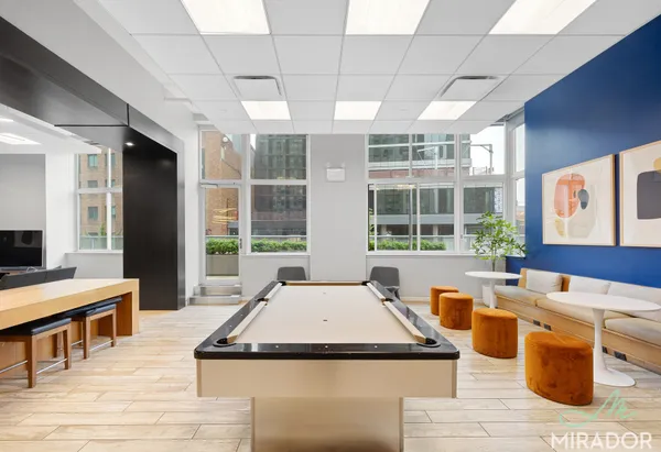 a room with gym equipment and a large window