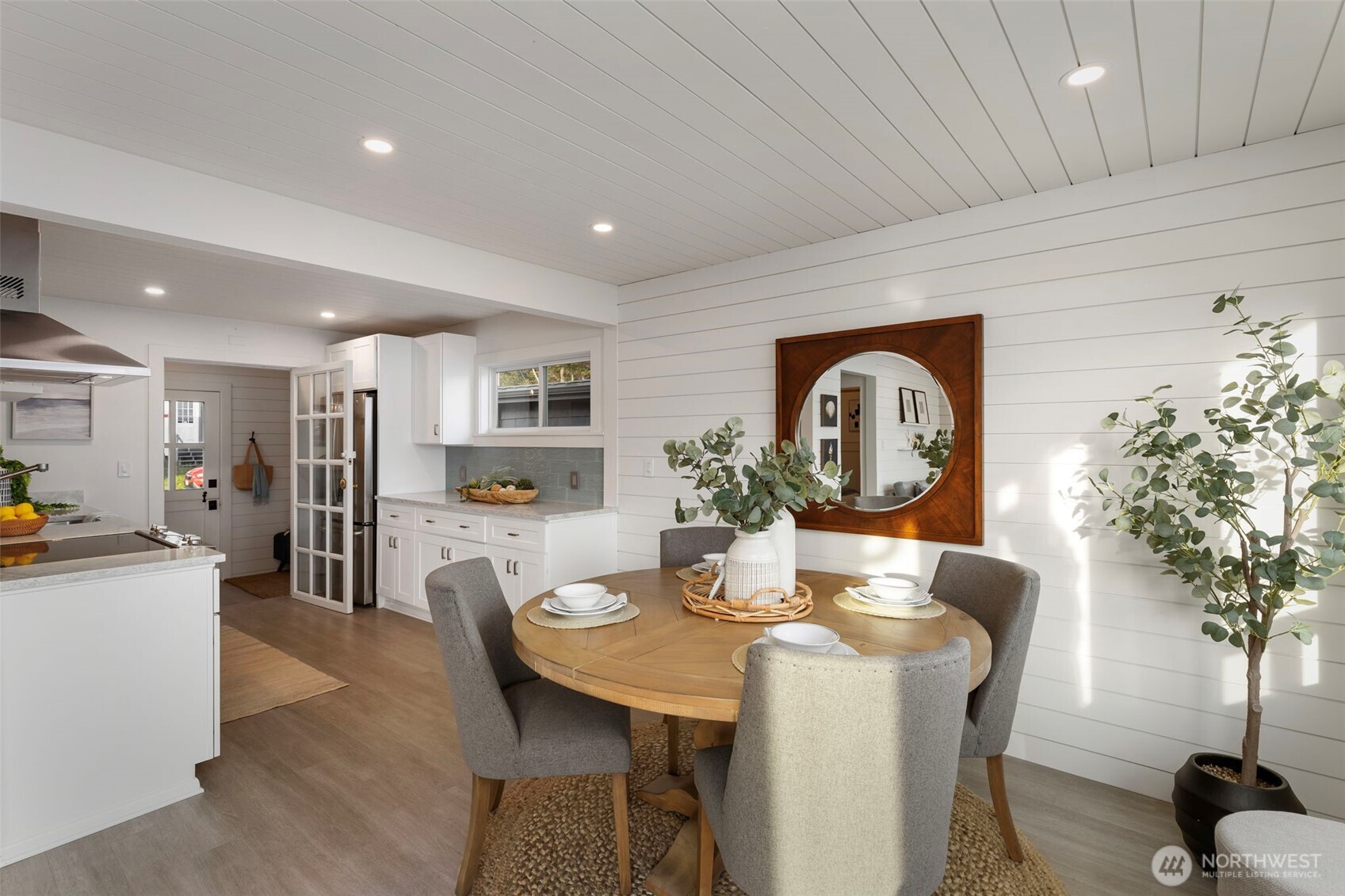 1180 Beckett Point Road Port Townsend, WA 98368 - Photo 16 of 31 a view of a dining room with furniture window and wooden floor