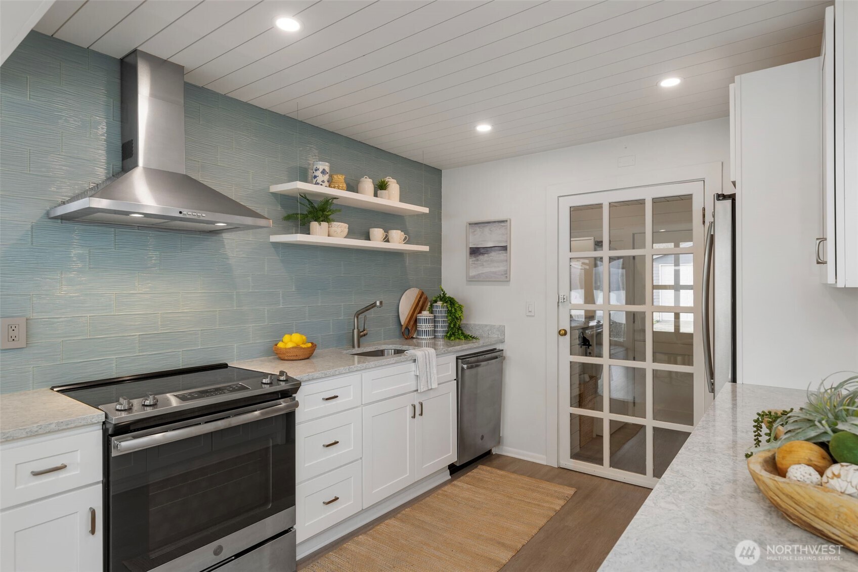 1180 Beckett Point Road Port Townsend, WA 98368 - Photo 18 of 31 a kitchen with stainless steel appliances granite countertop a stove and a sink