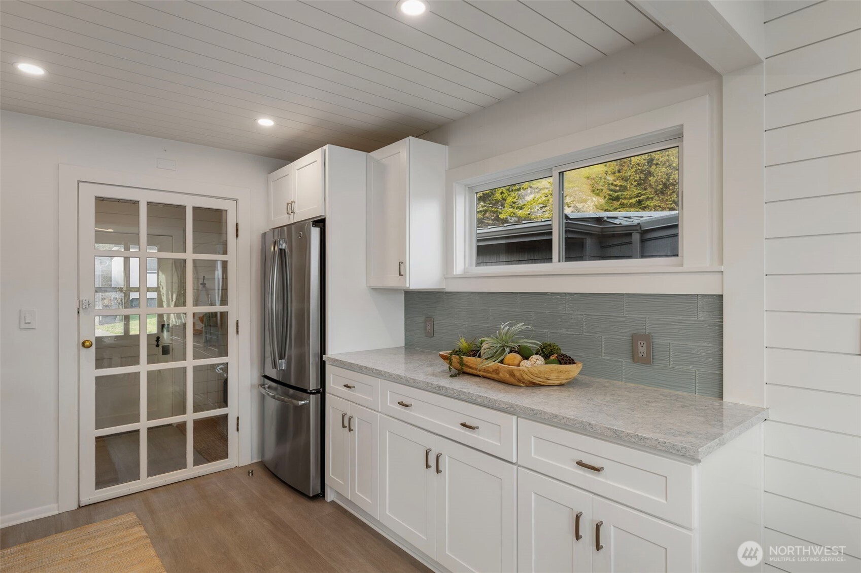 1180 Beckett Point Road Port Townsend, WA 98368 - Photo 19 of 31 a kitchen with stainless steel appliances granite countertop a refrigerator and a sink