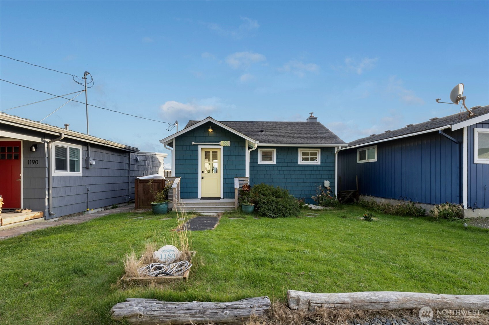 1180 Beckett Point Road Port Townsend, WA 98368 - Photo 2 of 31 a backyard of a house with table and chairs