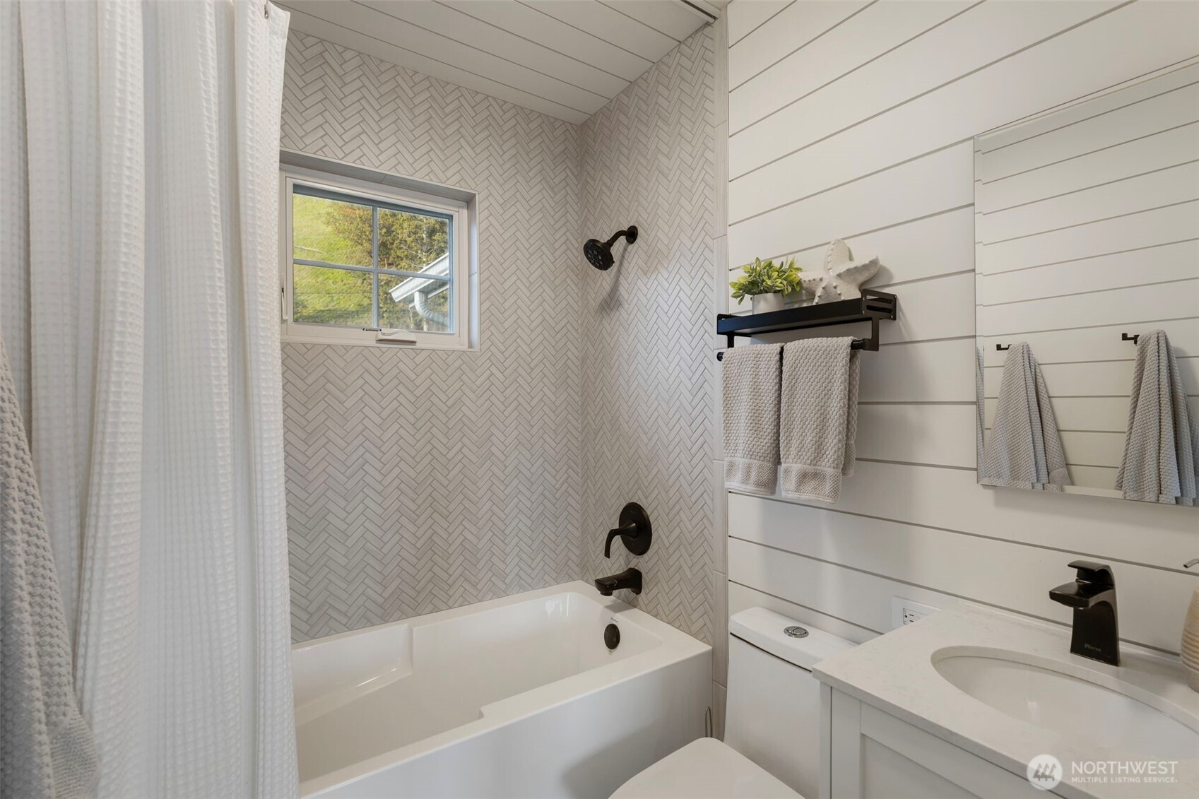 1180 Beckett Point Road Port Townsend, WA 98368 - Photo 22 of 31 a bathroom with a bathtub and sink