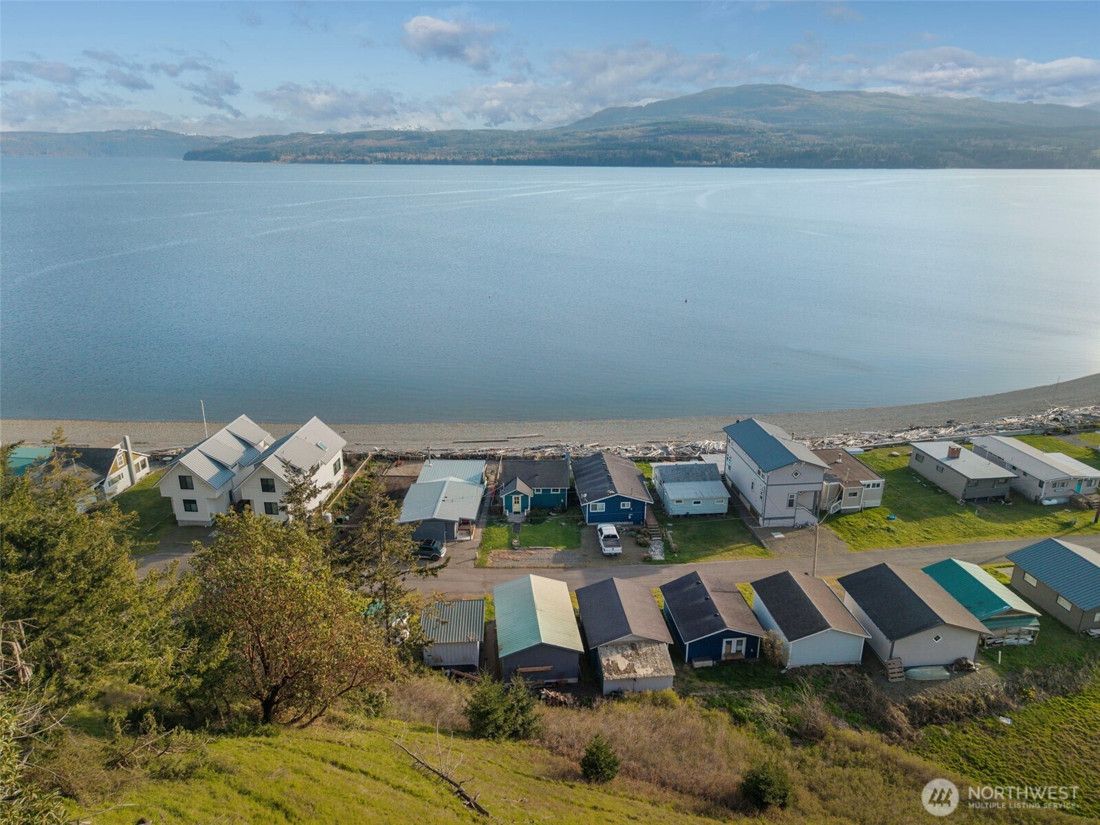 1180 Beckett Point Road Port Townsend, WA 98368 - Photo 30 of 31 an aerial view of a house with a yard swimming pool and outdoor seating