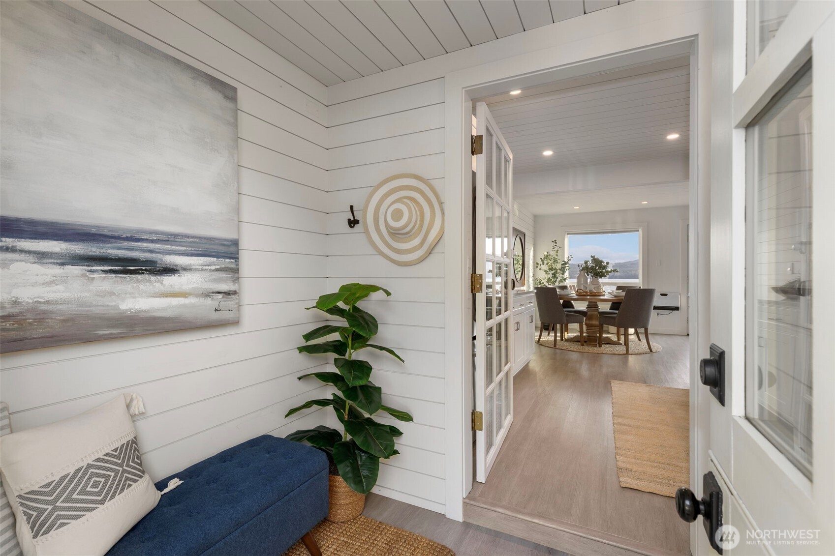 1180 Beckett Point Road Port Townsend, WA 98368 - Photo 9 of 31 a living room with furniture and a potted plant