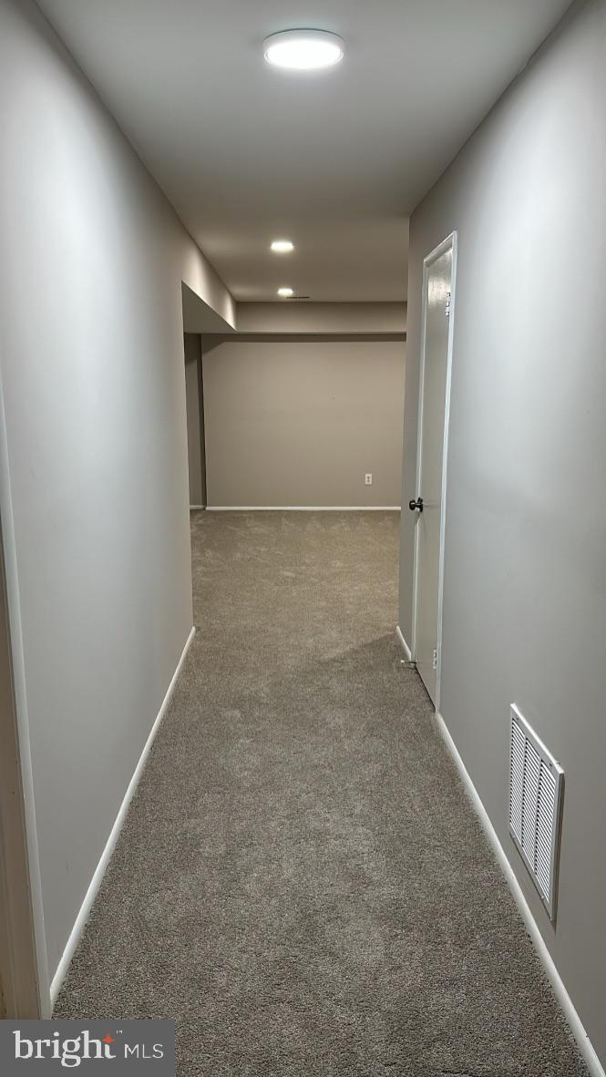 8211 Cagle Road Fort Washington, MD 20744 - Photo 36 of 49 Hallway leading to open Family Room space in Bsm't