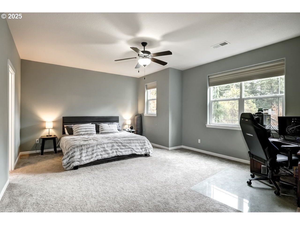 17647 Hardenbrook Avenue Sandy, OR 97055 - Photo 16 of 39 a bedroom with a bed a table and a large window