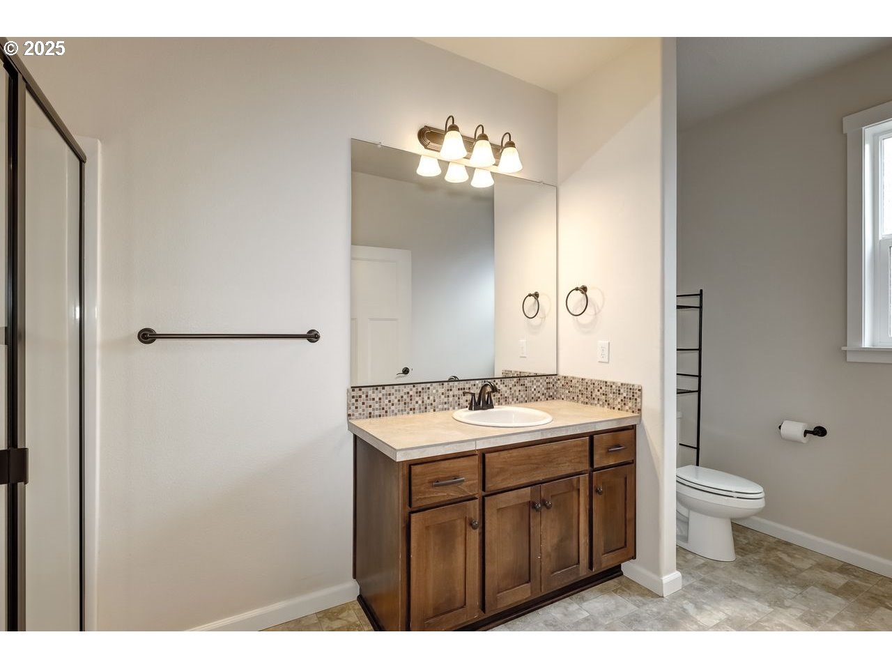17647 Hardenbrook Avenue Sandy, OR 97055 - Photo 22 of 39 a bathroom with a toilet sink and mirror