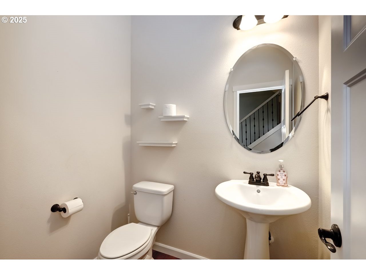 17647 Hardenbrook Avenue Sandy, OR 97055 - Photo 24 of 39 a bathroom with a sink a toilet and mirror