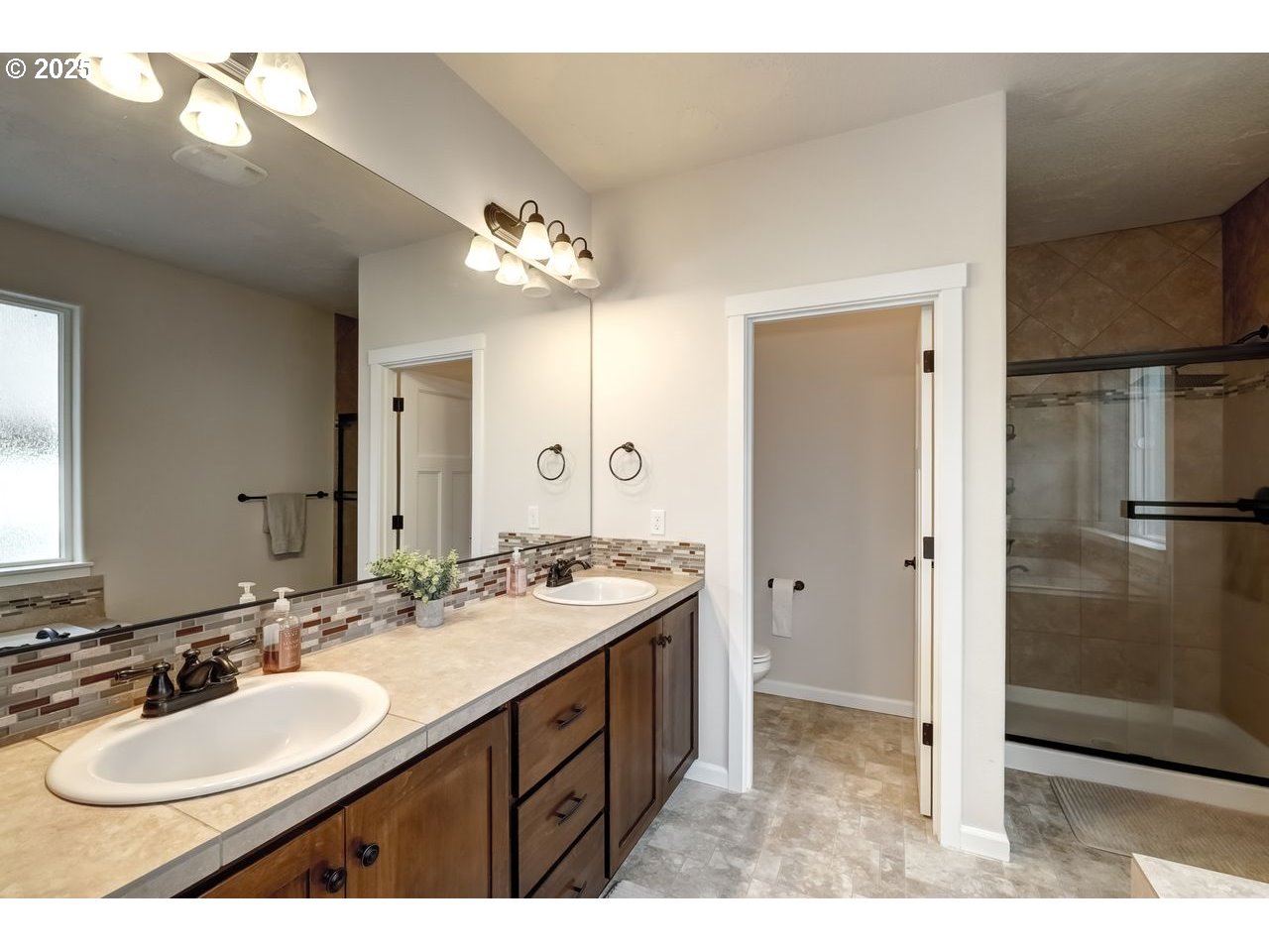 17647 Hardenbrook Avenue Sandy, OR 97055 - Photo 25 of 39 a bathroom with a sink a mirror and a shower