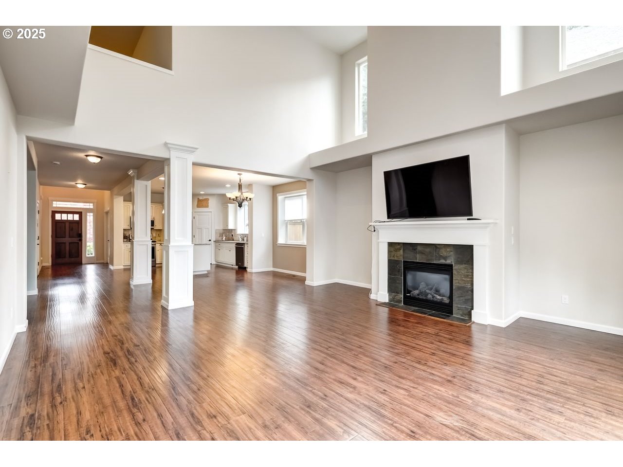 17647 Hardenbrook Avenue Sandy, OR 97055 - Photo 9 of 39 a view of a livingroom with wooden floor and a fireplace