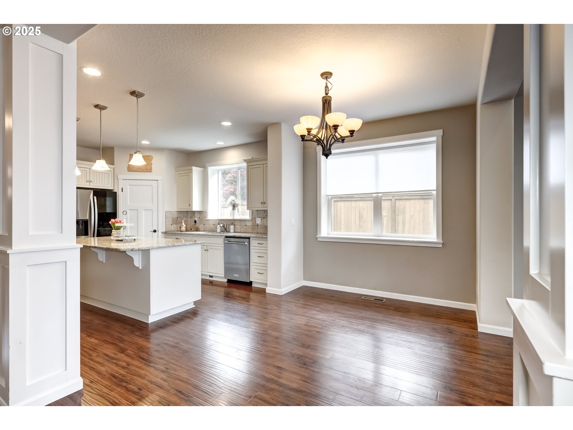 17647 Hardenbrook Avenue Sandy, OR 97055 - Photo 10 of 39 a view of kitchen with center island wooden floor and appliances