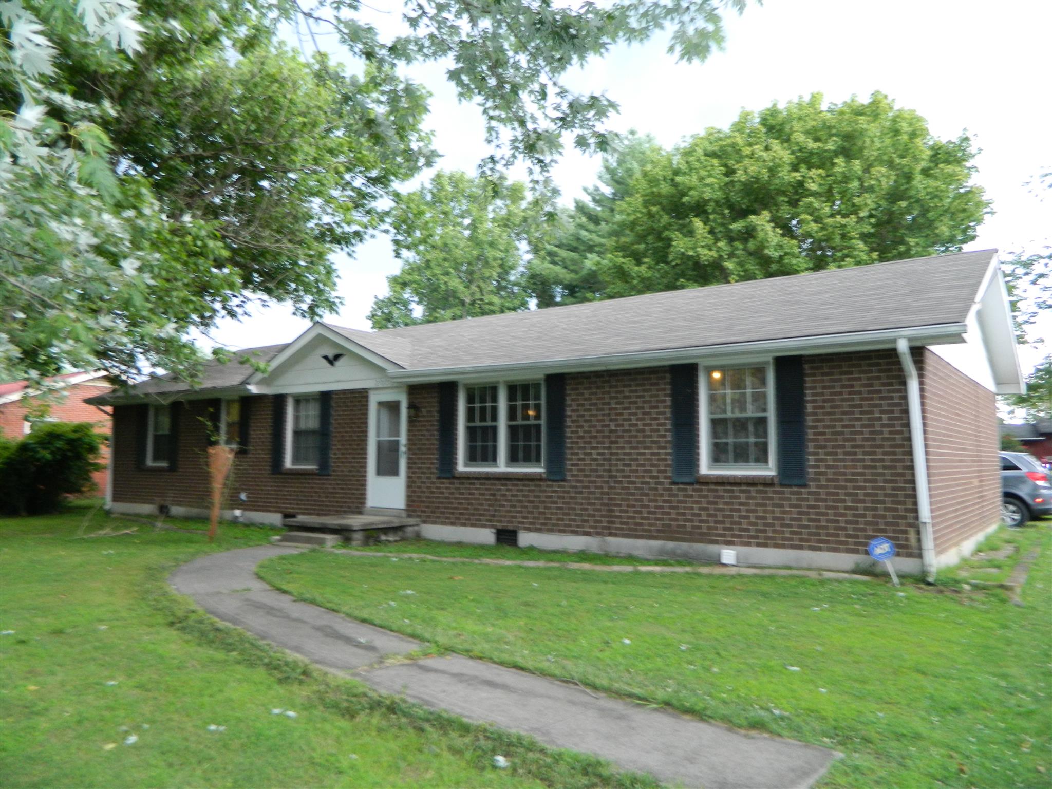 2053 Lake Road Greenbrier, TN 37073 - Photo 1 of 20 a front view of a house with a garden
