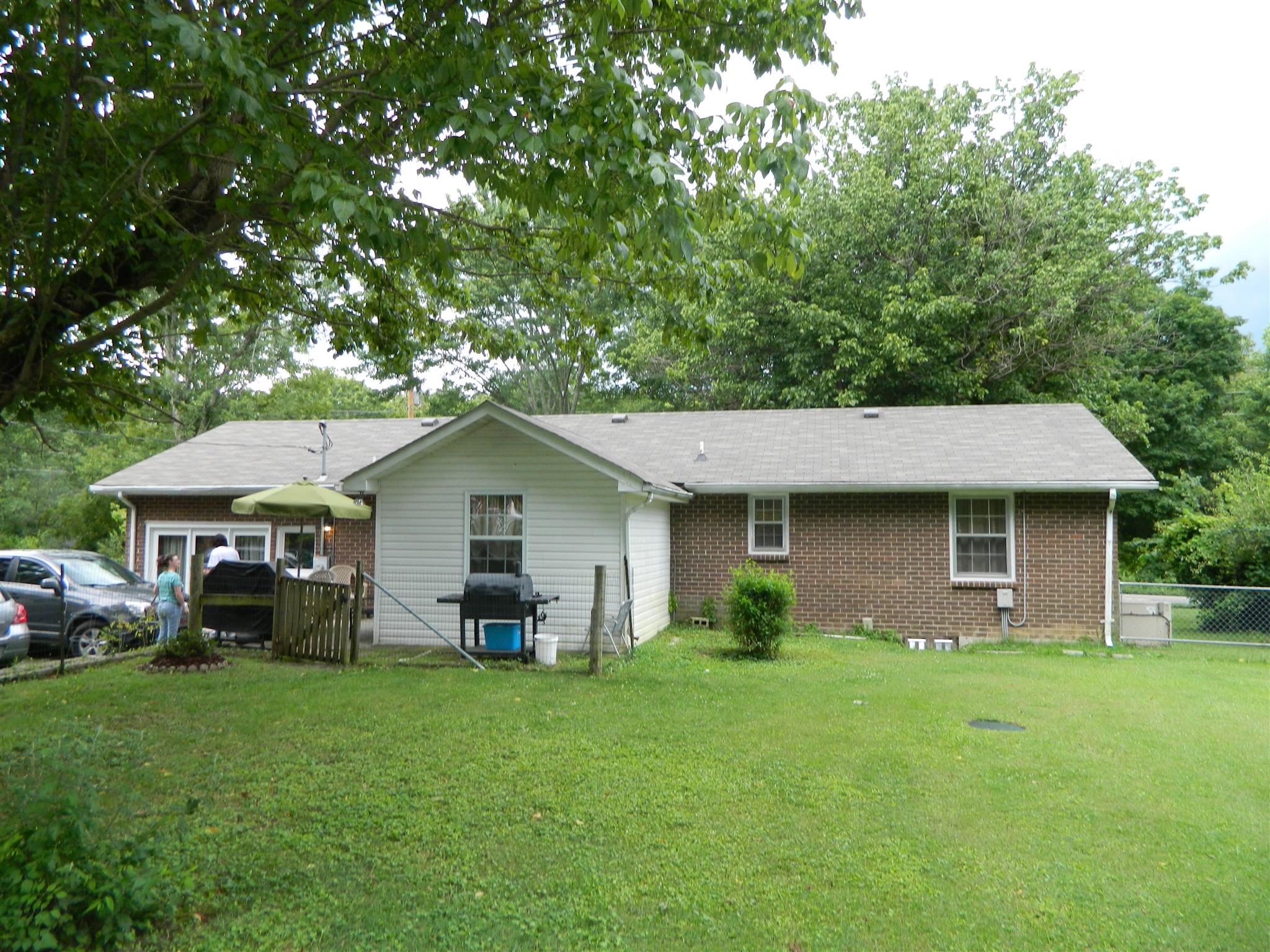 2053 Lake Road Greenbrier, TN 37073 - Photo 2 of 20 a front view of a house with garden