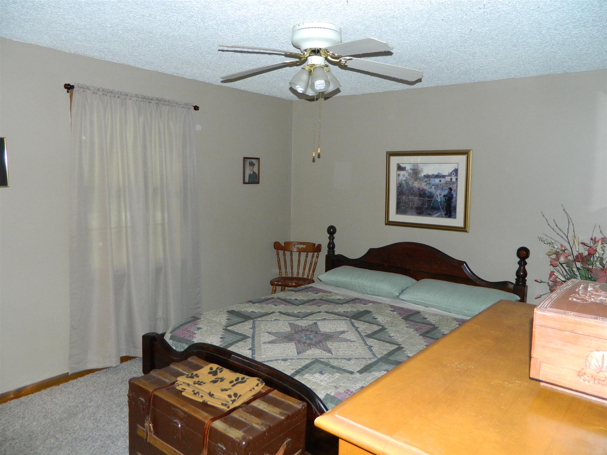 2053 Lake Road Greenbrier, TN 37073 - Photo 15 of 20 a bedroom with a bed and a chandelier