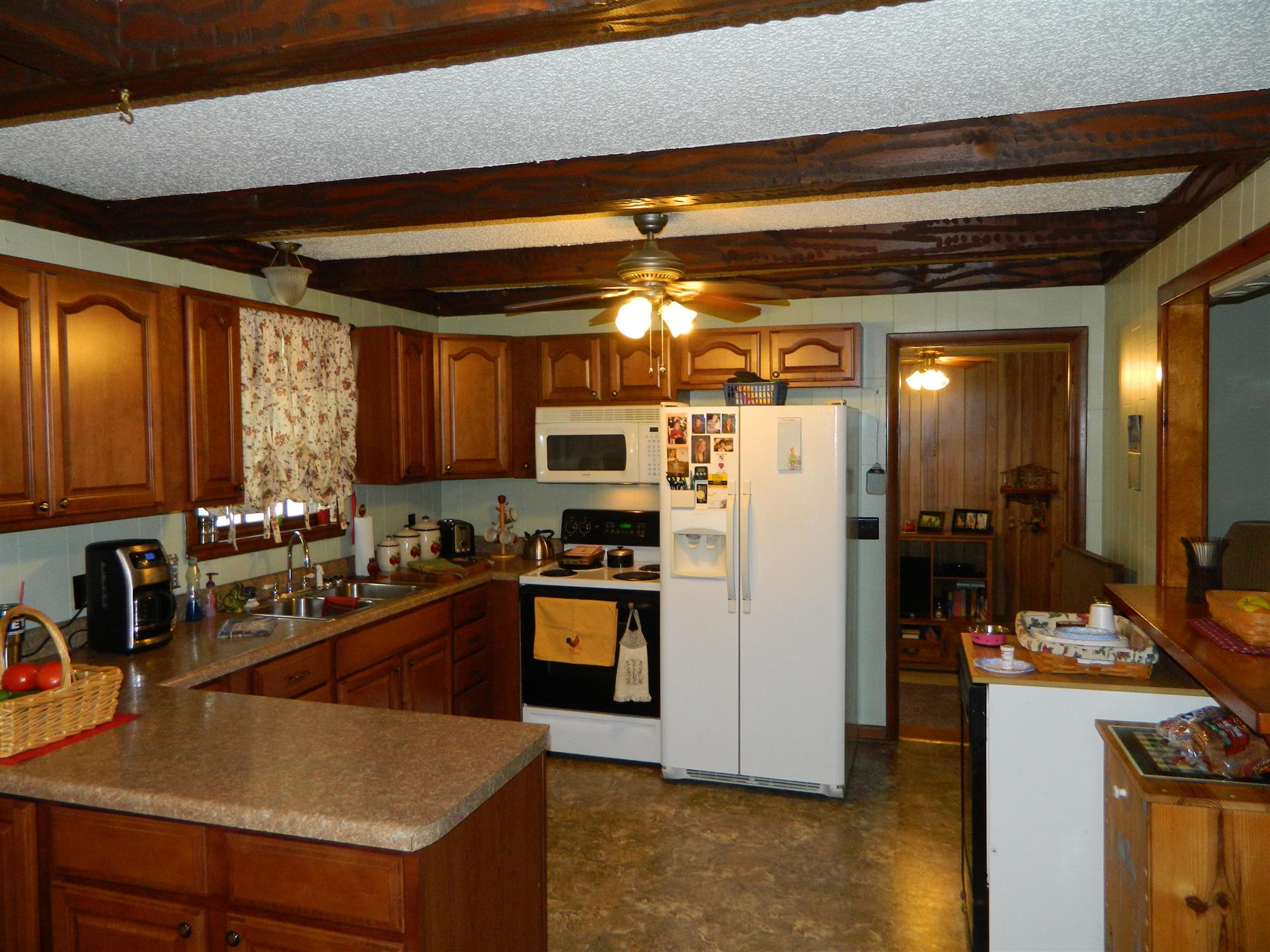 2053 Lake Road Greenbrier, TN 37073 - Photo 18 of 20 a kitchen with refrigerator and cabinets