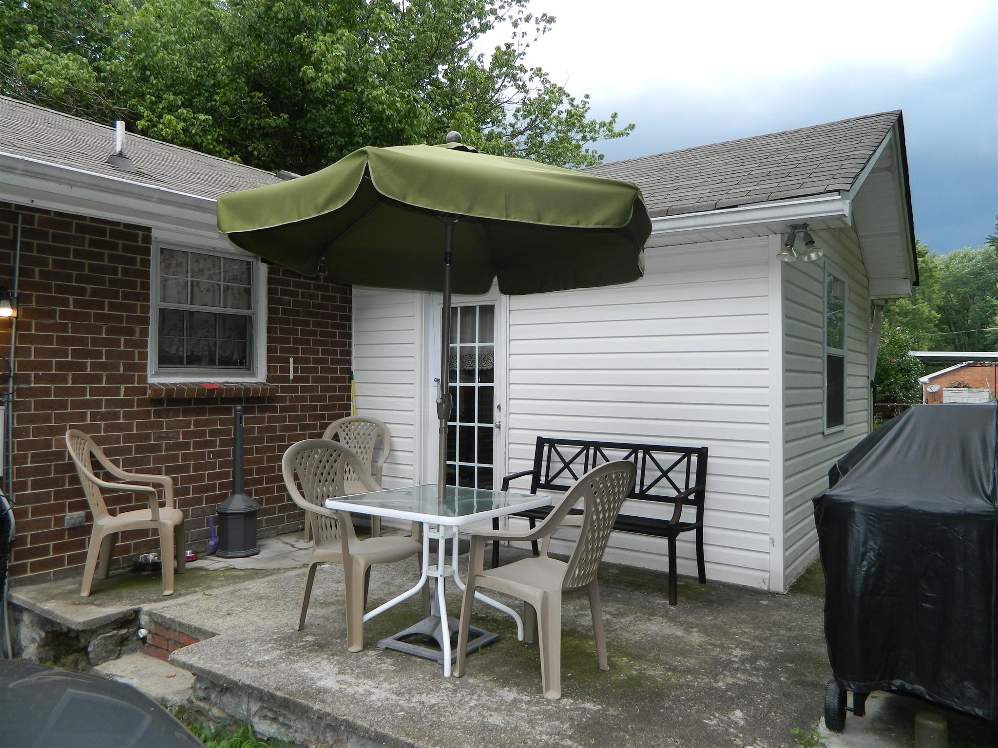 2053 Lake Road Greenbrier, TN 37073 - Photo 3 of 20 a backyard of a house with table and chairs