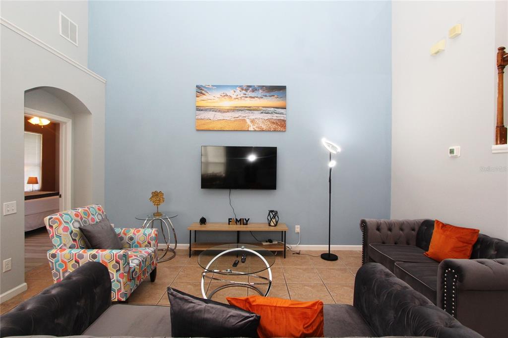8211 Fan Palm Way Kissimmee, FL 34747 - Photo 13 of 41 a living room with furniture and a flat screen tv