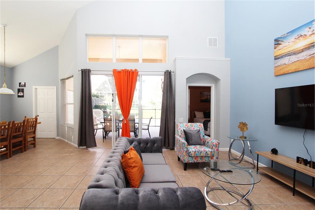 8211 Fan Palm Way Kissimmee, FL 34747 - Photo 14 of 41 a living room with furniture and a flat screen tv