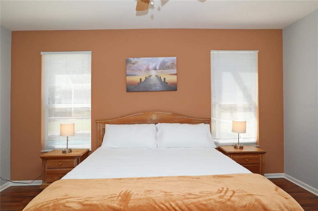 8211 Fan Palm Way Kissimmee, FL 34747 - Photo 17 of 41 a bedroom with a large bed and a window