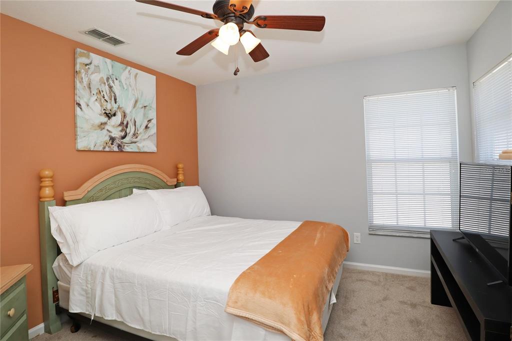 8211 Fan Palm Way Kissimmee, FL 34747 - Photo 23 of 41 a bedroom with a bed and a window
