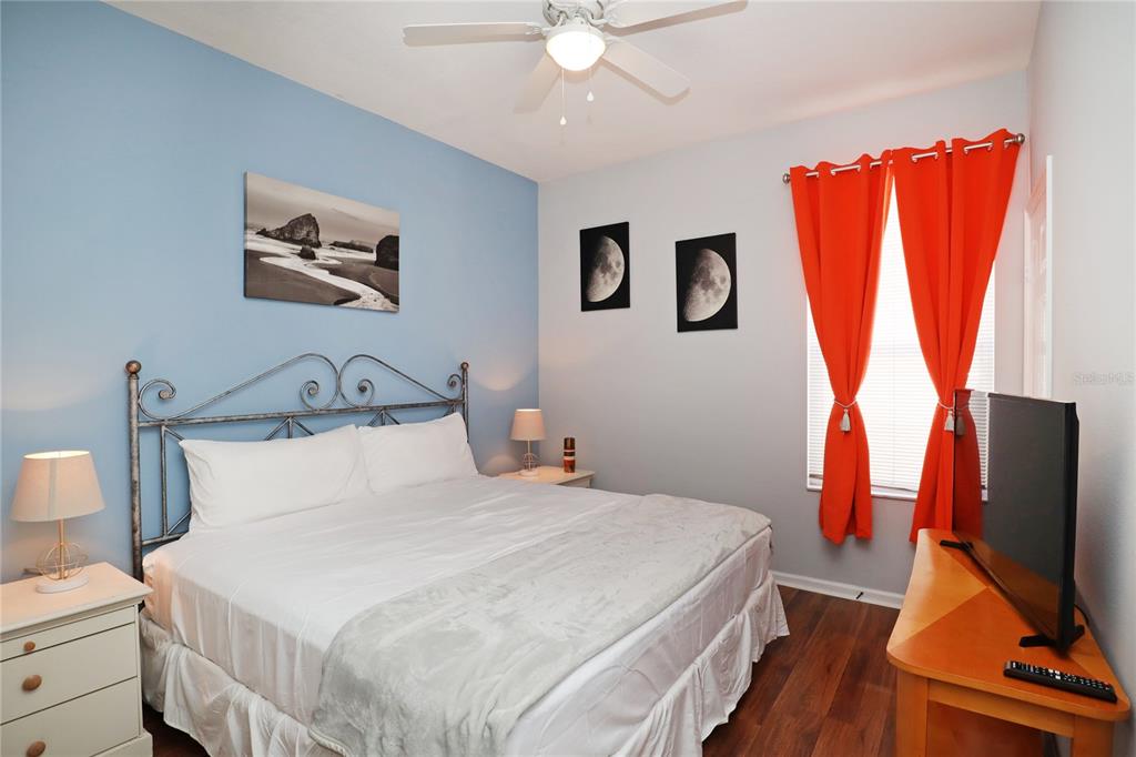 8211 Fan Palm Way Kissimmee, FL 34747 - Photo 31 of 41 a bedroom with a bed and a flat screen tv