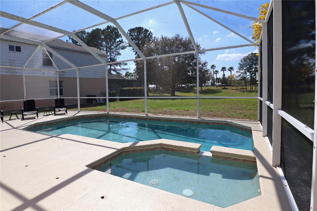 8211 Fan Palm Way Kissimmee, FL 34747 - Photo 33 of 41 a view of a swimming pool with an outdoor seating