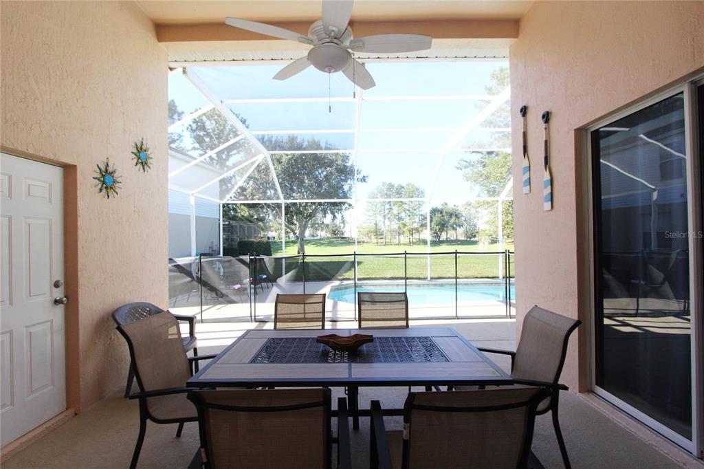 8211 Fan Palm Way Kissimmee, FL 34747 - Photo 36 of 41 a view of a dining room with furniture window and outside view