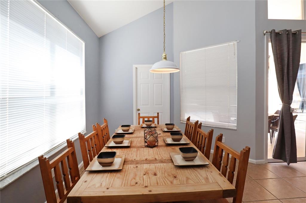 8211 Fan Palm Way Kissimmee, FL 34747 - Photo 8 of 41 a view of a dining room with furniture window and outside view