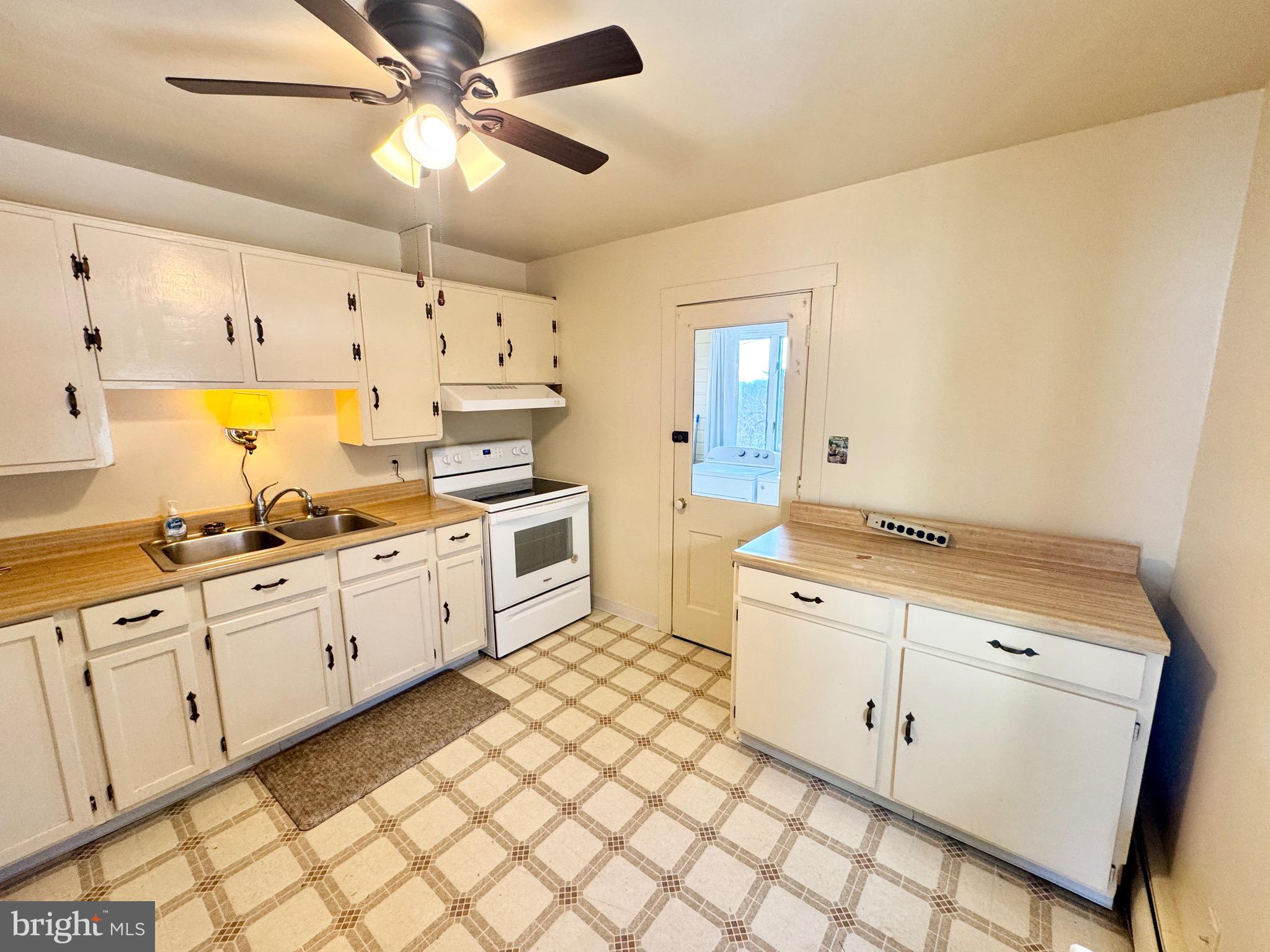 2847 Baltimore Boulevard, Unit B Finksburg, MD 21048 - Photo 12 of 25 a large white kitchen with cabinets