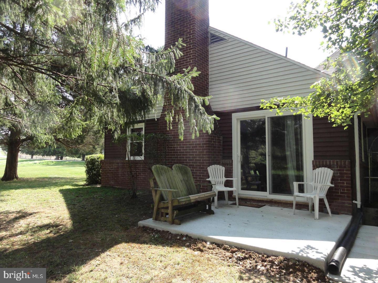 2847 Baltimore Boulevard, Unit B Finksburg, MD 21048 - Photo 24 of 25 a view of a patio with a table chairs and a yard
