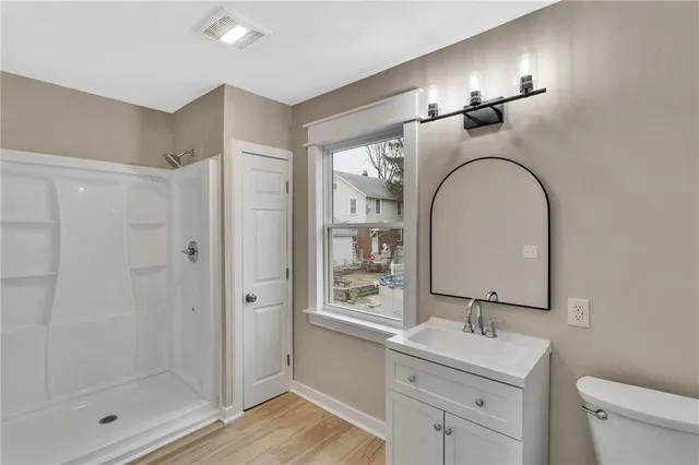 a view of a hallway with windows