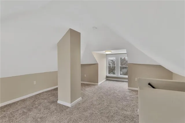 a kitchen with a refrigerator and a sink