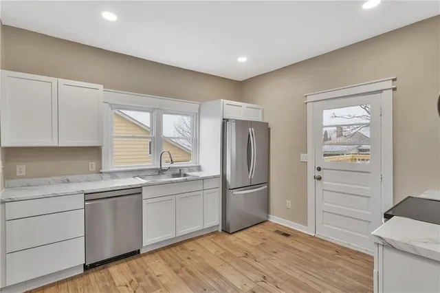 a view of a chair and table in the balcony