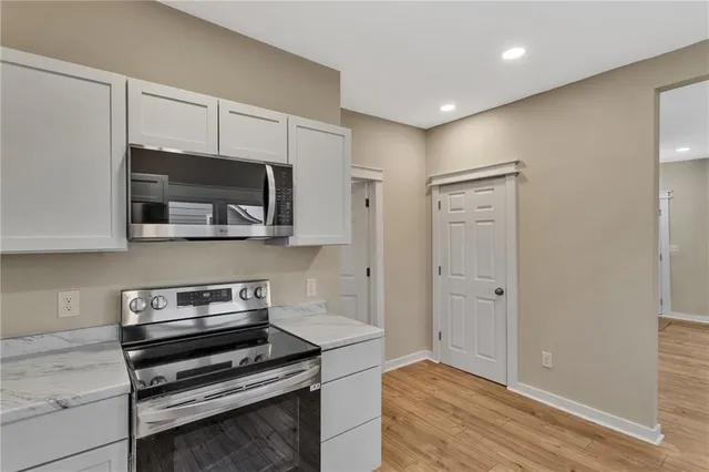 a view of an empty room with wooden walls