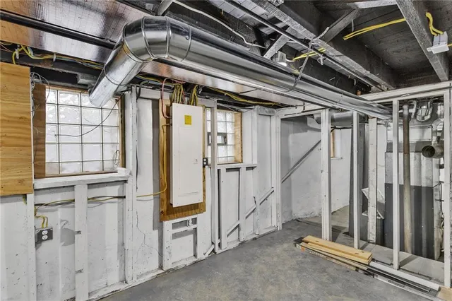 a view of a white house with a sink and yard