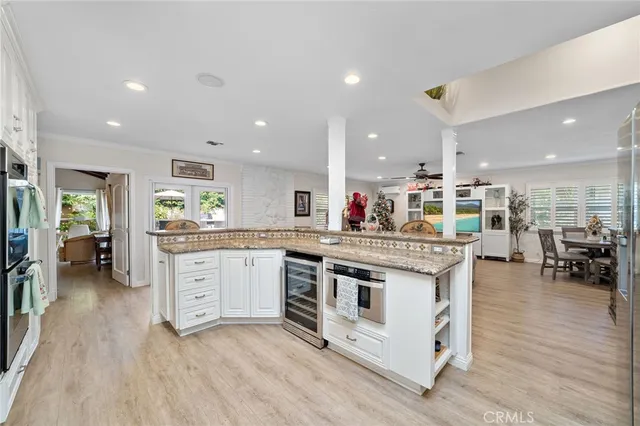 a kitchen with stainless steel appliances granite countertop a stove and a refrigerator