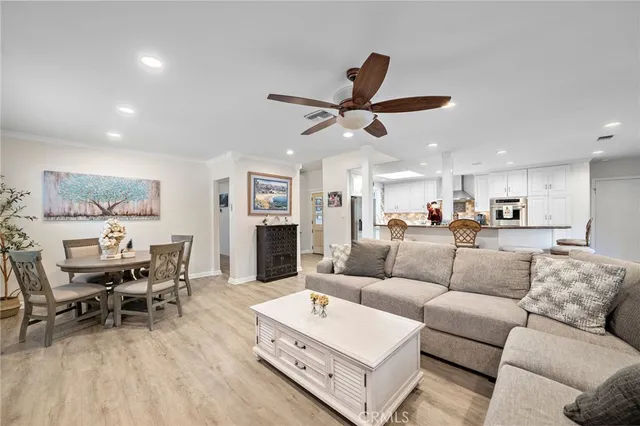 a bedroom with a bed a fireplace and a large window