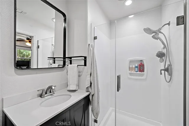 a view of a patio with table and chairs potted plants with wooden fence